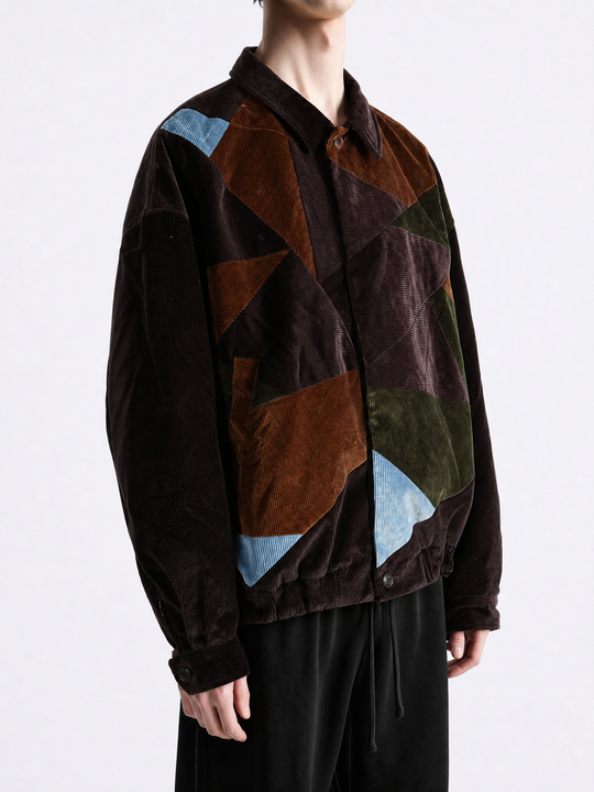 Brown jacket worn by a person, showing the jacket fit