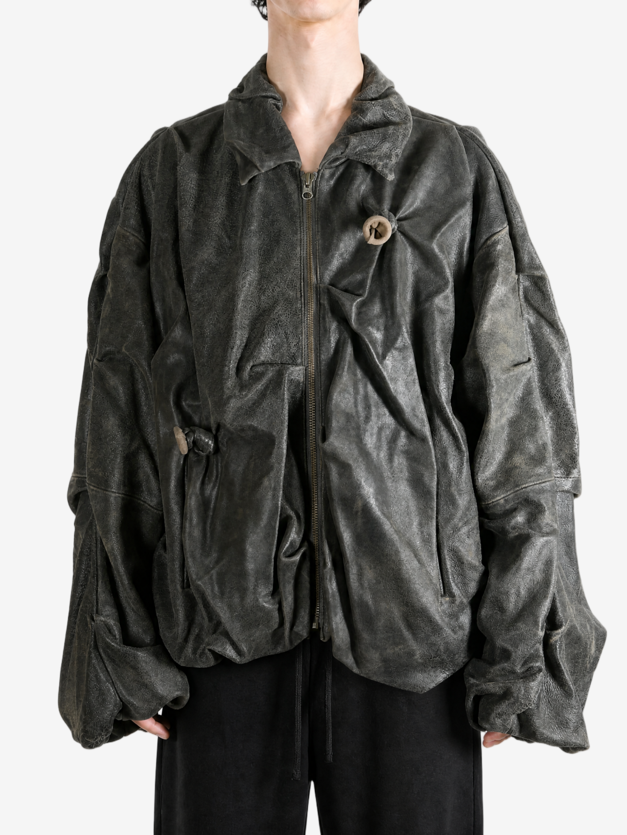 Black jacket worn by a person, showing the jacket fit