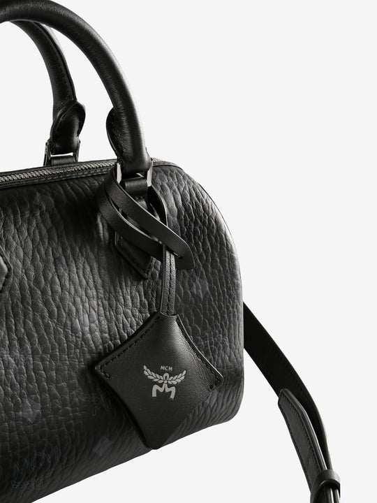 Close up of black bag, showing texture of the leather fabricr