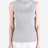 Grey shirt worn by a person, showing the shirt fit