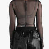 Black top worn by a person, showing the top's fit