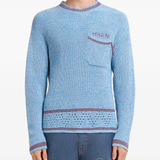 Close up of blue sweater, showing texture of the Cotton fabric