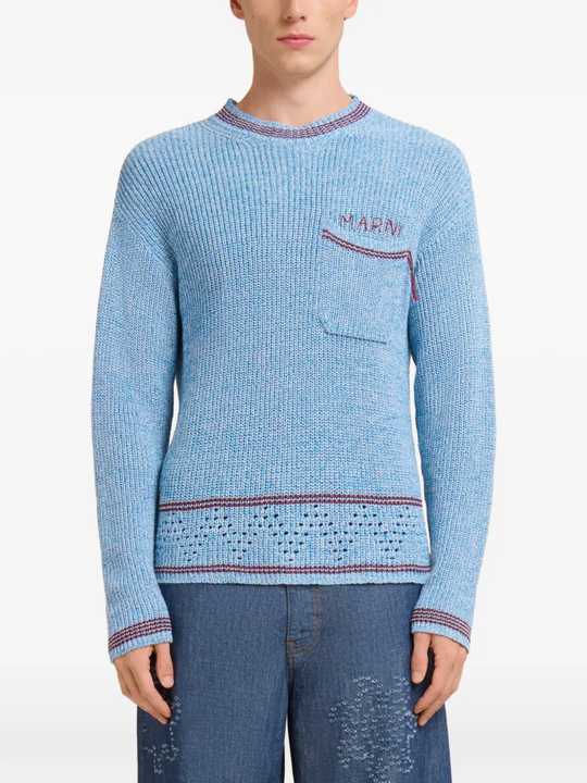 Close up of blue sweater, showing texture of the Cotton fabric