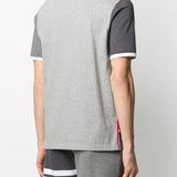 Grey T-shirt worn by a person, showing the shirt’s fit