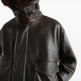 Black jacket worn by a person, showing the jacket fit