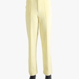 Yellow pants worn by a person, showing the pants' fit