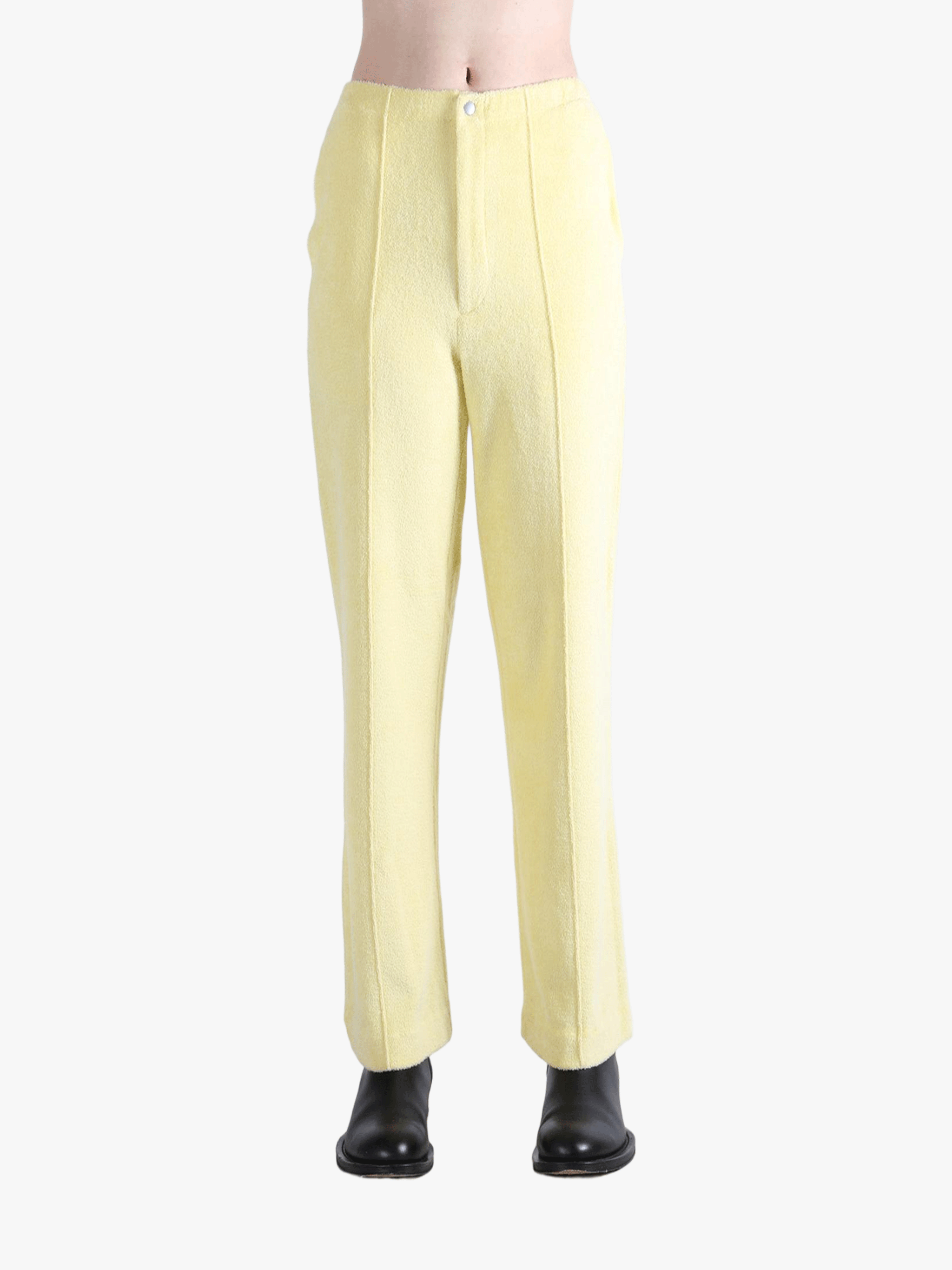 Yellow pants worn by a person, showing the pants' fit