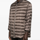 Brown parka worn by a person, showing the parka fit