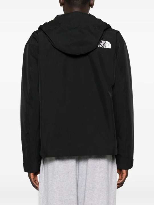 Black jackets worn by a person, showing the jackets fit