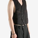 Grey vest worn by a person, showing the vest's fit