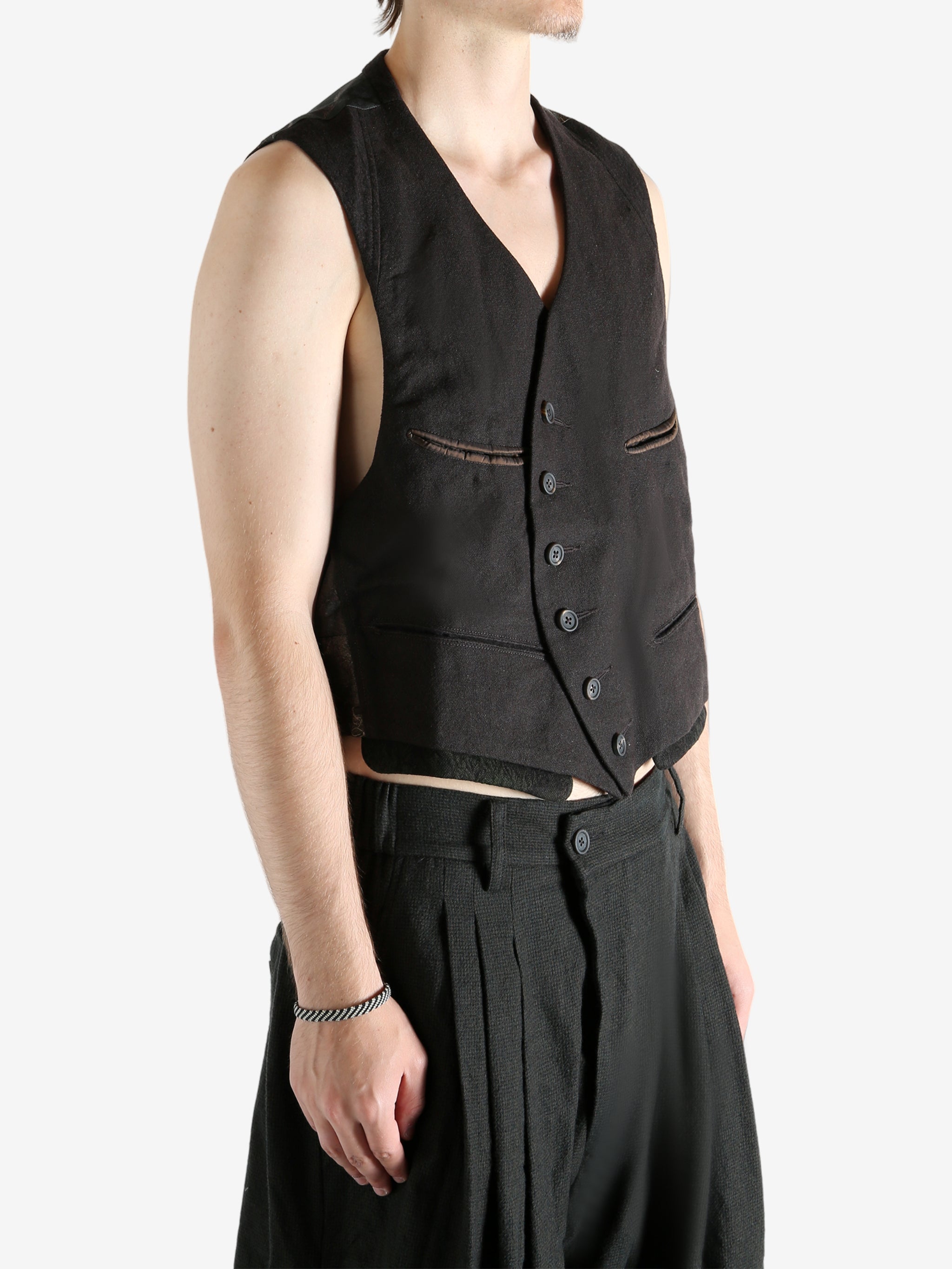 Grey vest worn by a person, showing the vest's fit