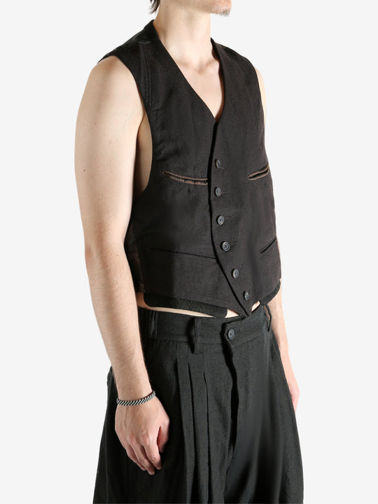 Grey vest worn by a person, showing the vest's fit