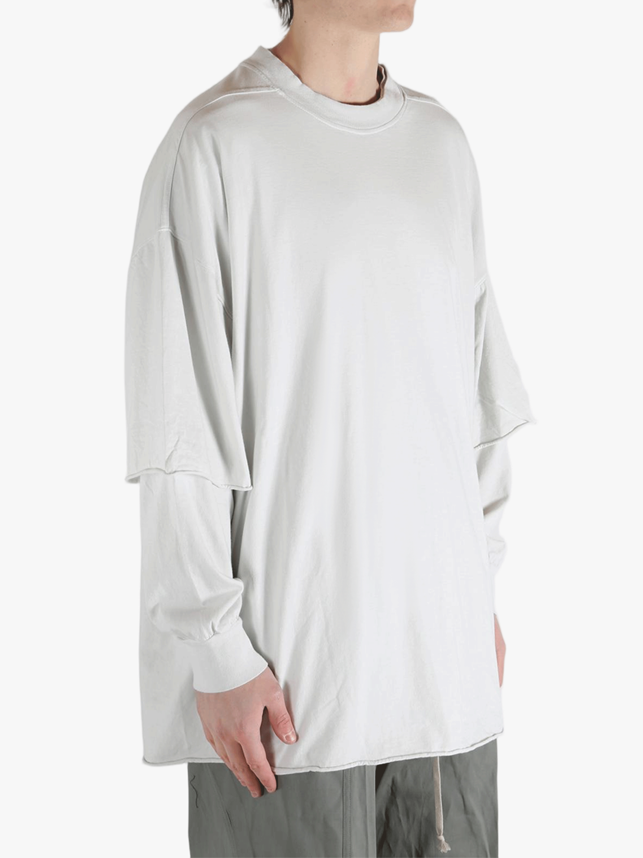 White sweats worn by a person, showing the sweats fit