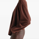 Burgundy top worn by a person, showing the top fit