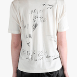 White shirt worn by a person, showing the shirt's fit
