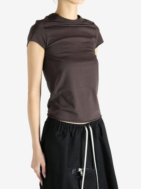 Brown shirt worn by a person, showing the shirt fit