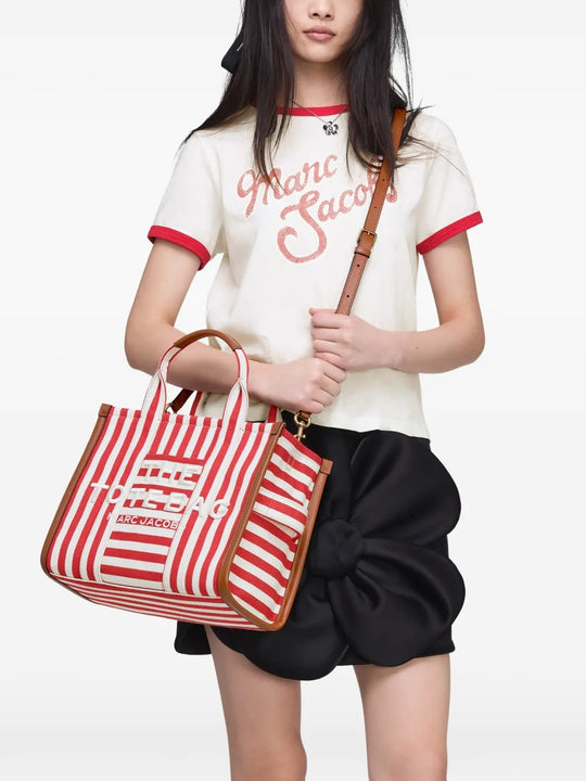Red bag worn by a person, showing the bag's fit