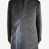 Black jacket worn by a person, showing the jacket's fit