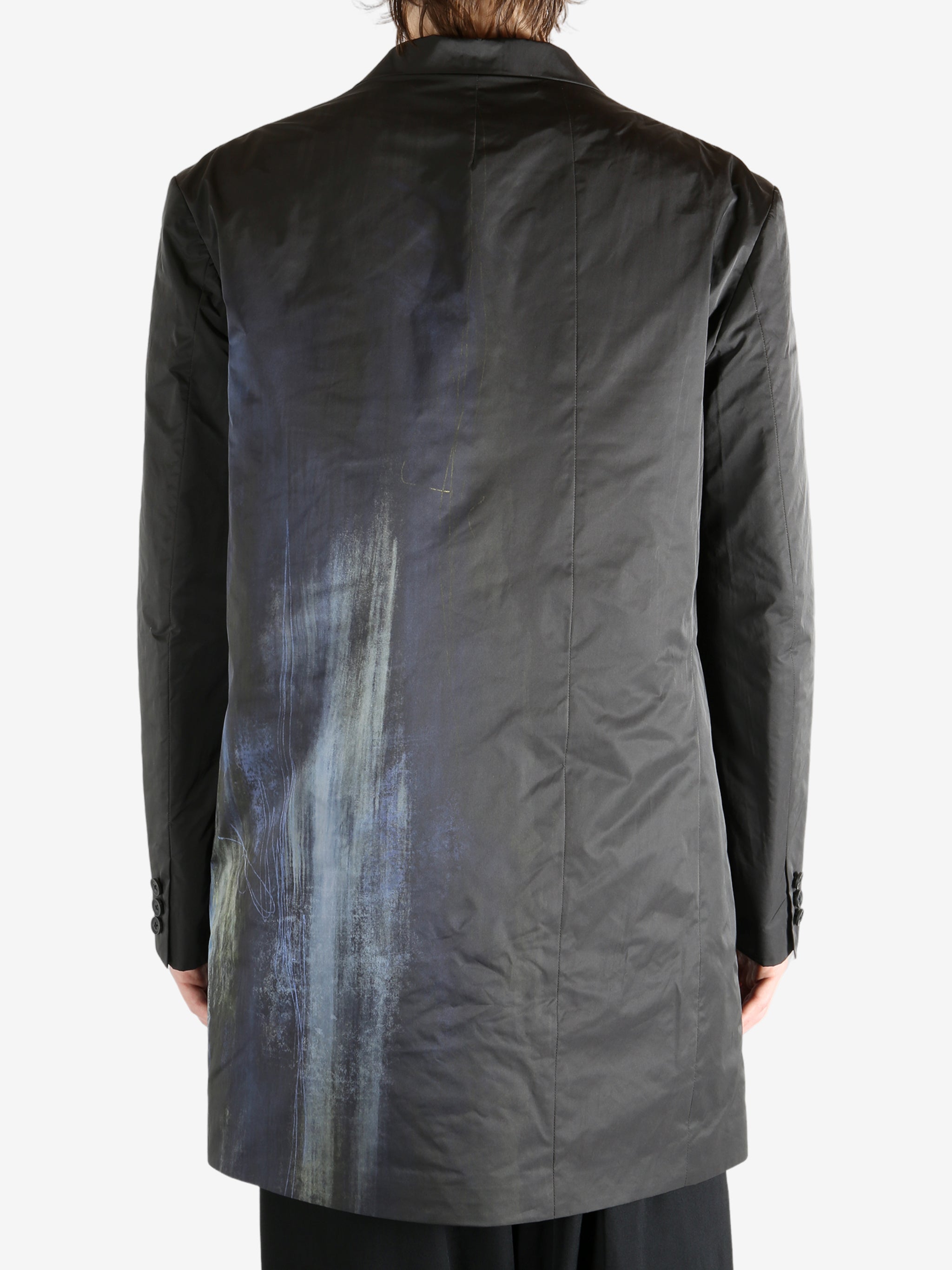 Black jacket worn by a person, showing the jacket's fit