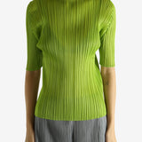 Green shirt worn by a person, showing the shirt's fit