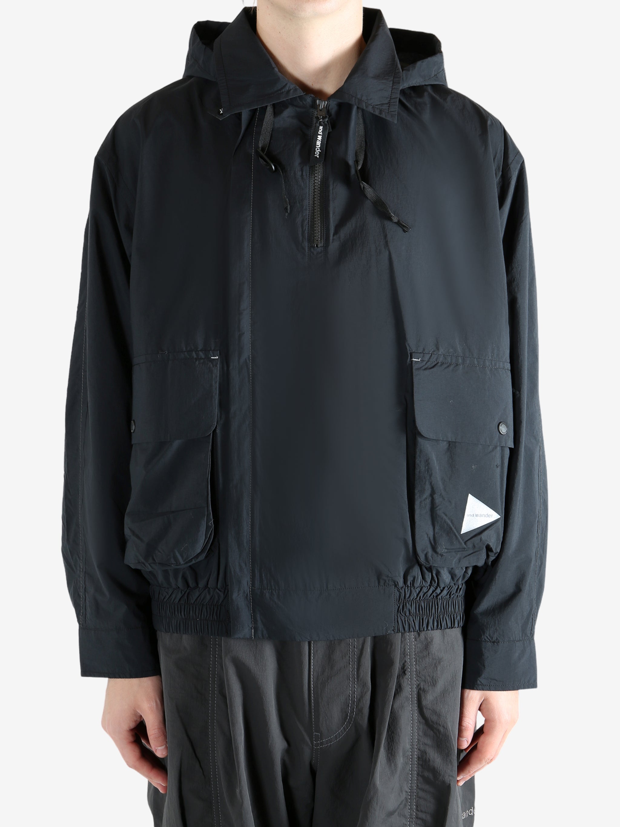 Black jacket worn by a person, showing the jacket fit