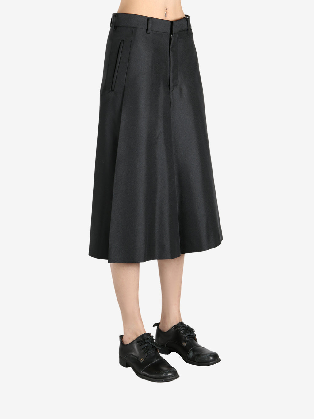 Black pants worn by a person, showing the pants fit