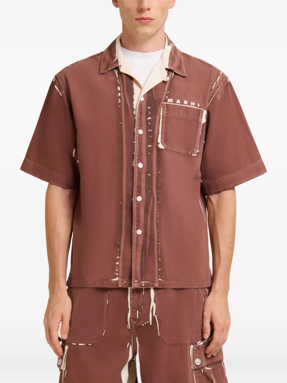 Brown shirt worn by a person, showing the shirt fit