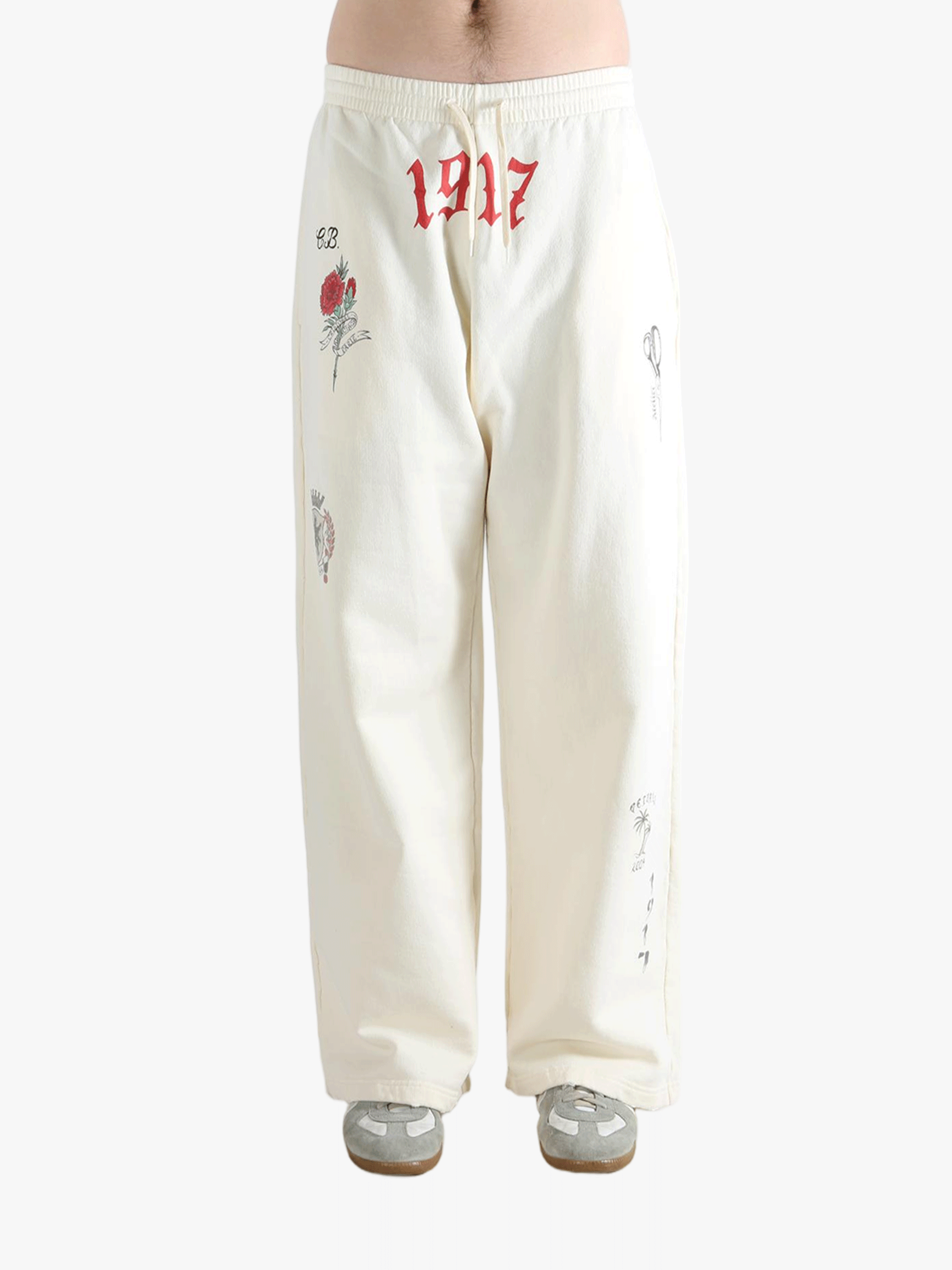 White pants worn by a person, showing the pants fit
