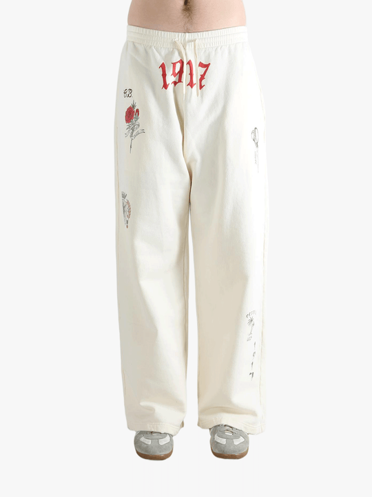 White pants worn by a person, showing the pants fit