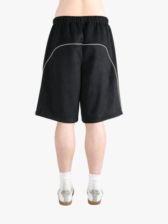 Black shorts worn by a person, showing the shorts fit