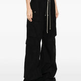 Black pants worn by a person, showing the pants fit