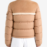 Brown jacket worn by a person, showing the jacket fit