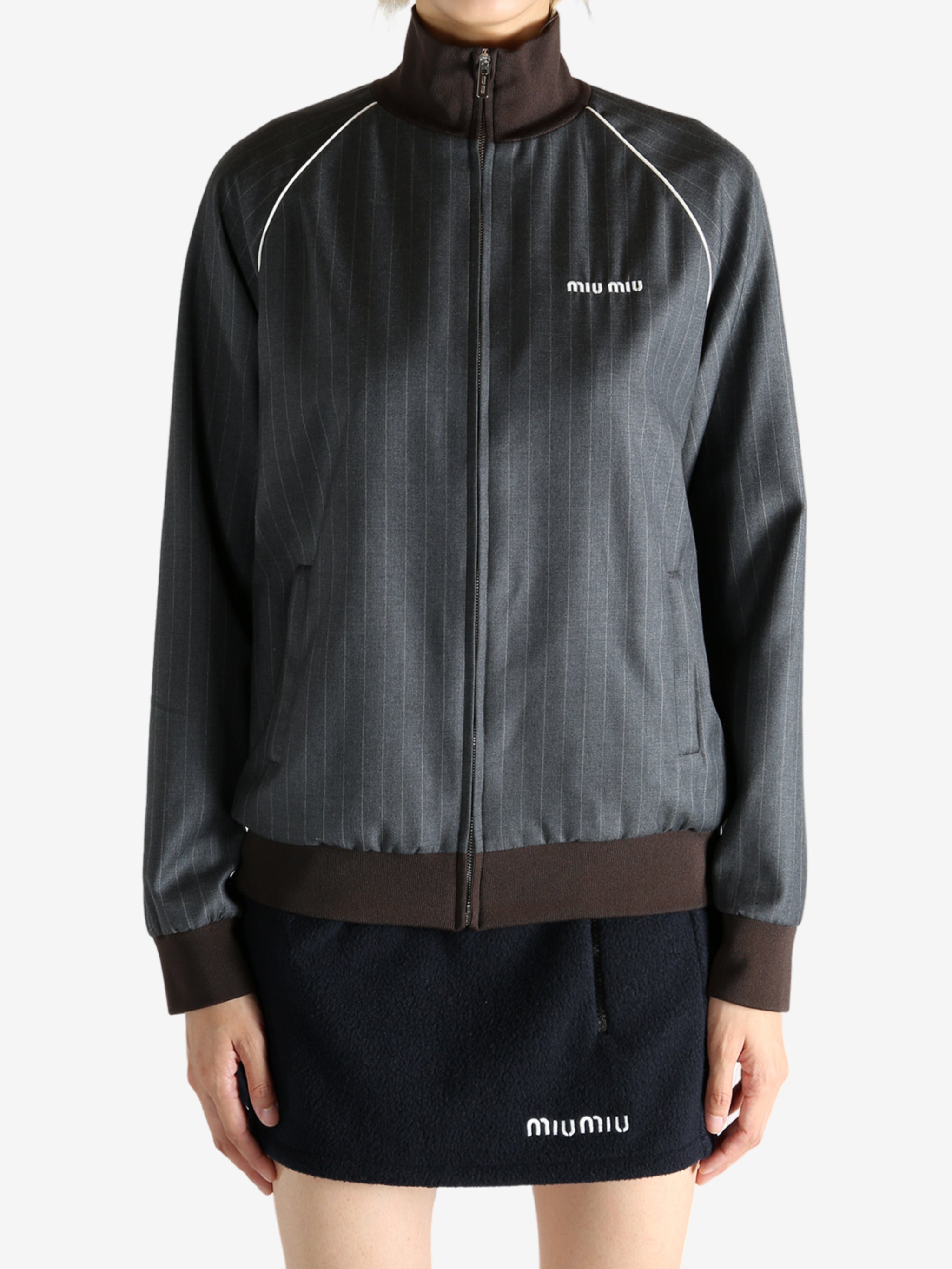 Grey jacket worn by a person, showing the jacket's fit