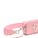 close up of pink bags, showing texture of the leather fabric