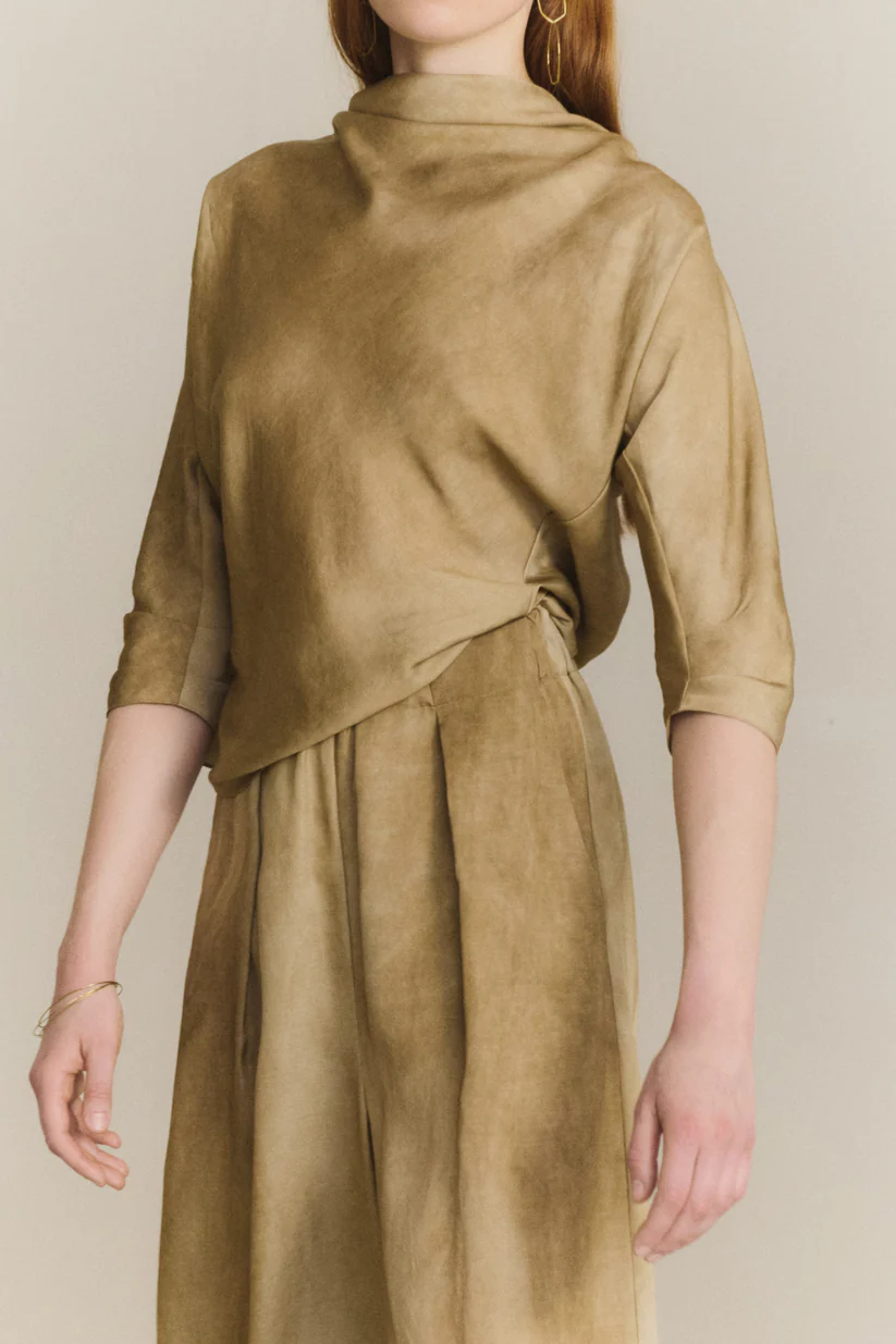 Brown top worn by a person, showing the top fit