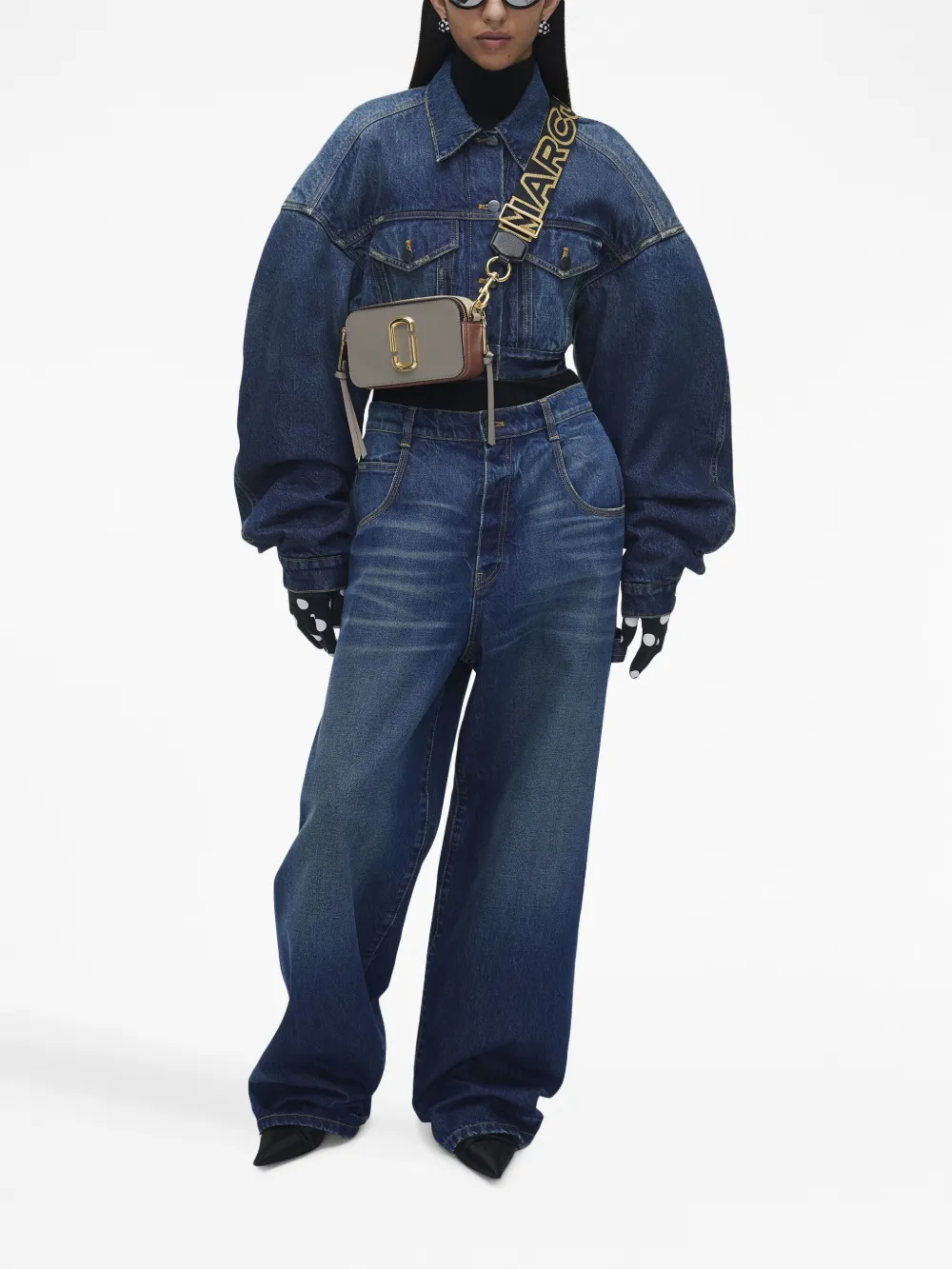 grey bags worn by a person, showing the bags fit