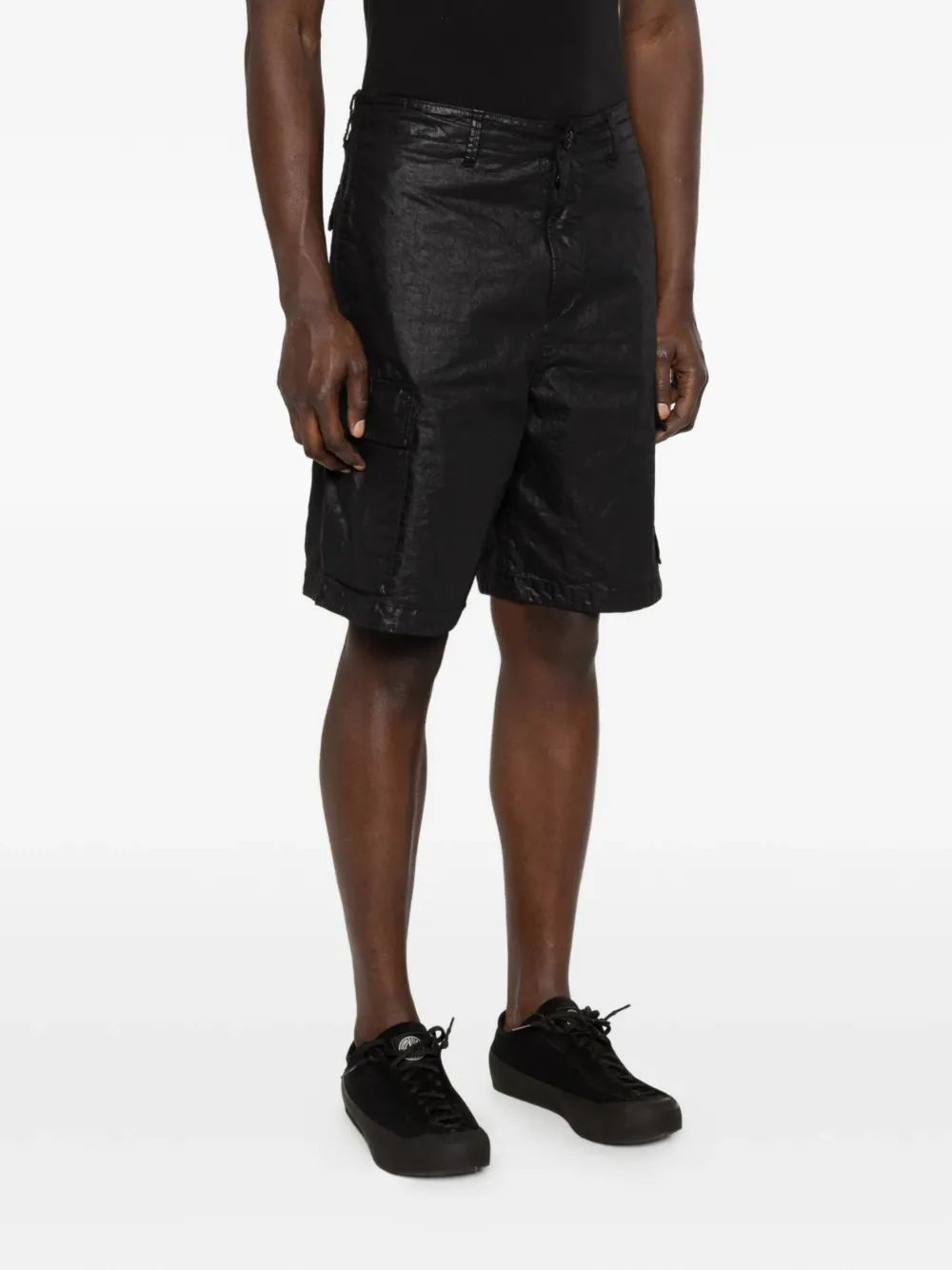 Black shorts worn by a person, showing the black shorts' fit