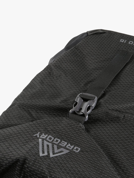 Close up of black backpack, showing texture of the polyester fabric