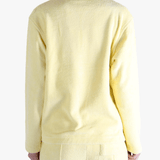 Yellow shirt worn by a person, showing the shirt's fit