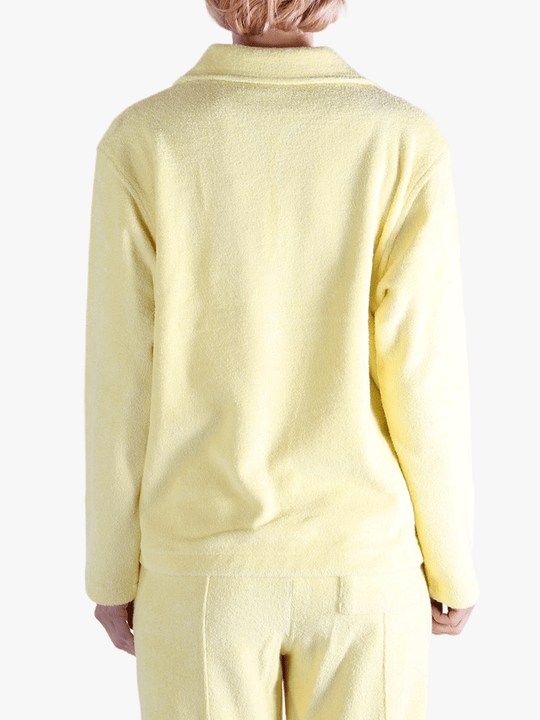 Yellow shirt worn by a person, showing the shirt's fit