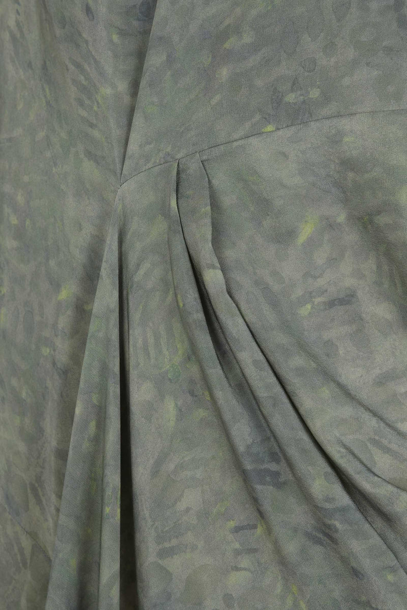 Close-up of green dress,showing texture of the silk fabric