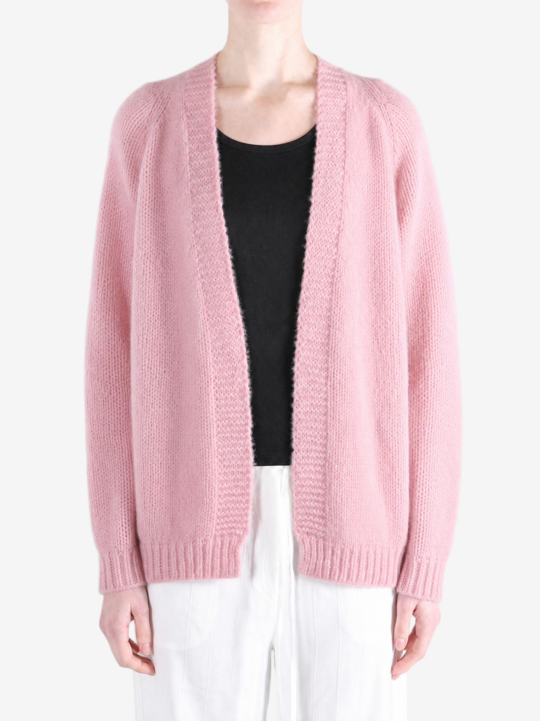 Pink knitwear worn by a person, showing the knitwear fit