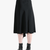 Black skirt worn by a person, showing the skirt fit