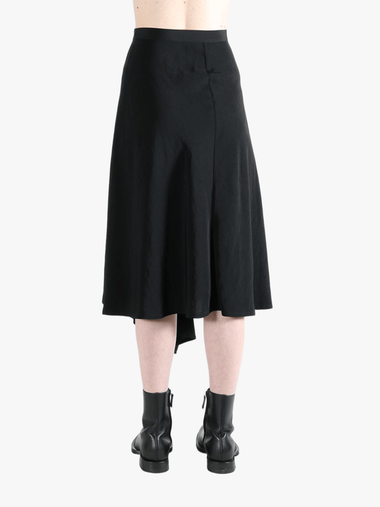 Black skirt worn by a person, showing the skirt fit