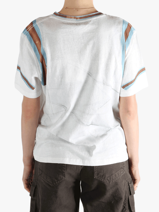 White T-shirt worn by a person, showing the T-shirt's fit