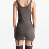 Brown top worn by a person, showing the top’s fit