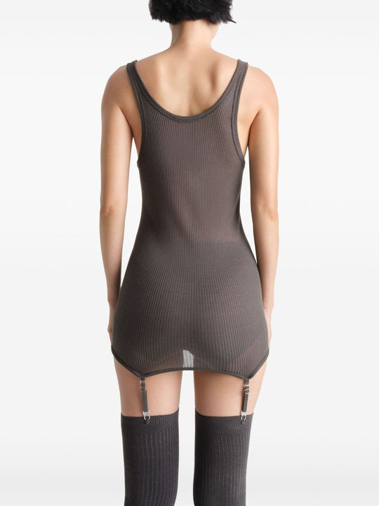 Brown top worn by a person, showing the top’s fit