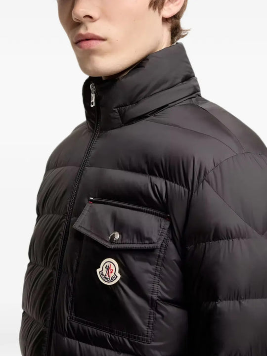 Black jacket worn by a person, showing the jacket fit