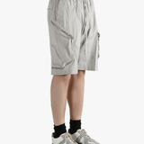 Grey shorts worn by a person, showing the shorts fit