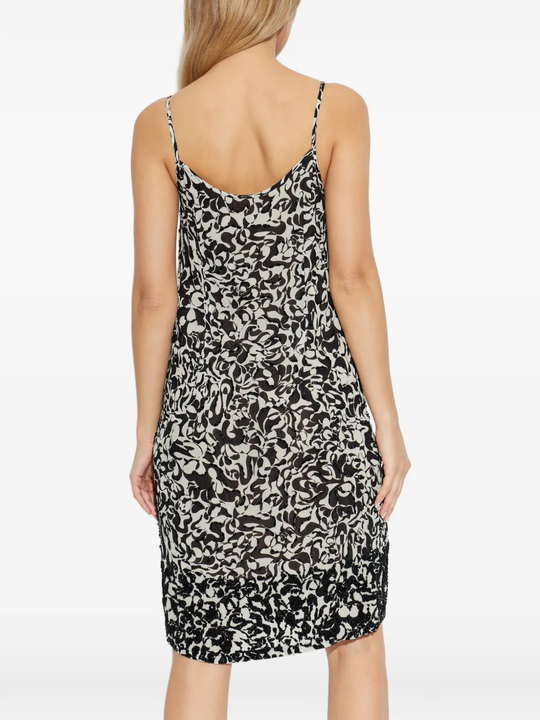 Black dress worn by a person, showing the dress fit